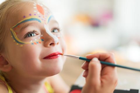 girl having her face painted