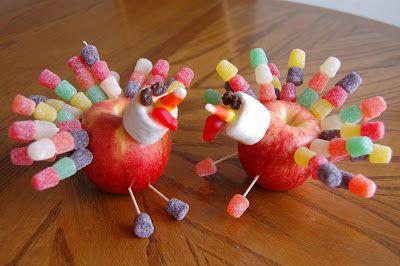 Two turkeys made using apples for the bodies, and candy for the head and tail feathers
